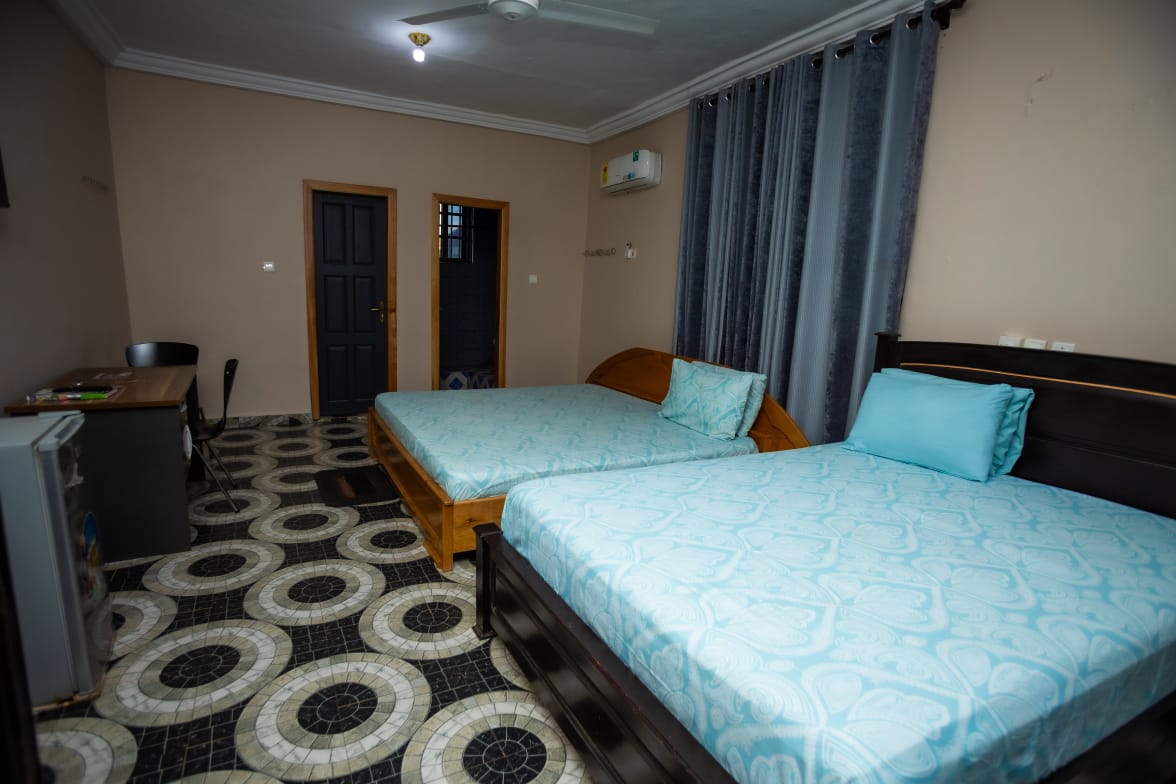 Room C6 Family Suite with two beds and air conditioning