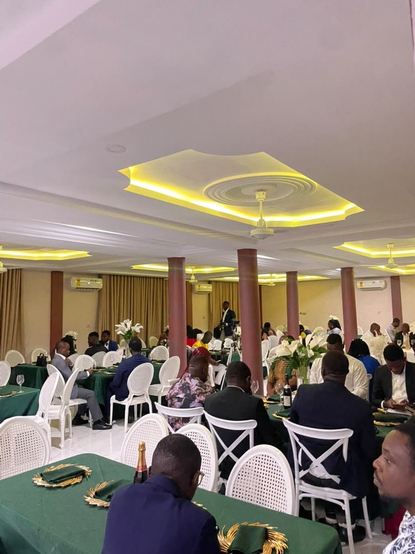Abank Village restaurant full of guests under warm gold lighting