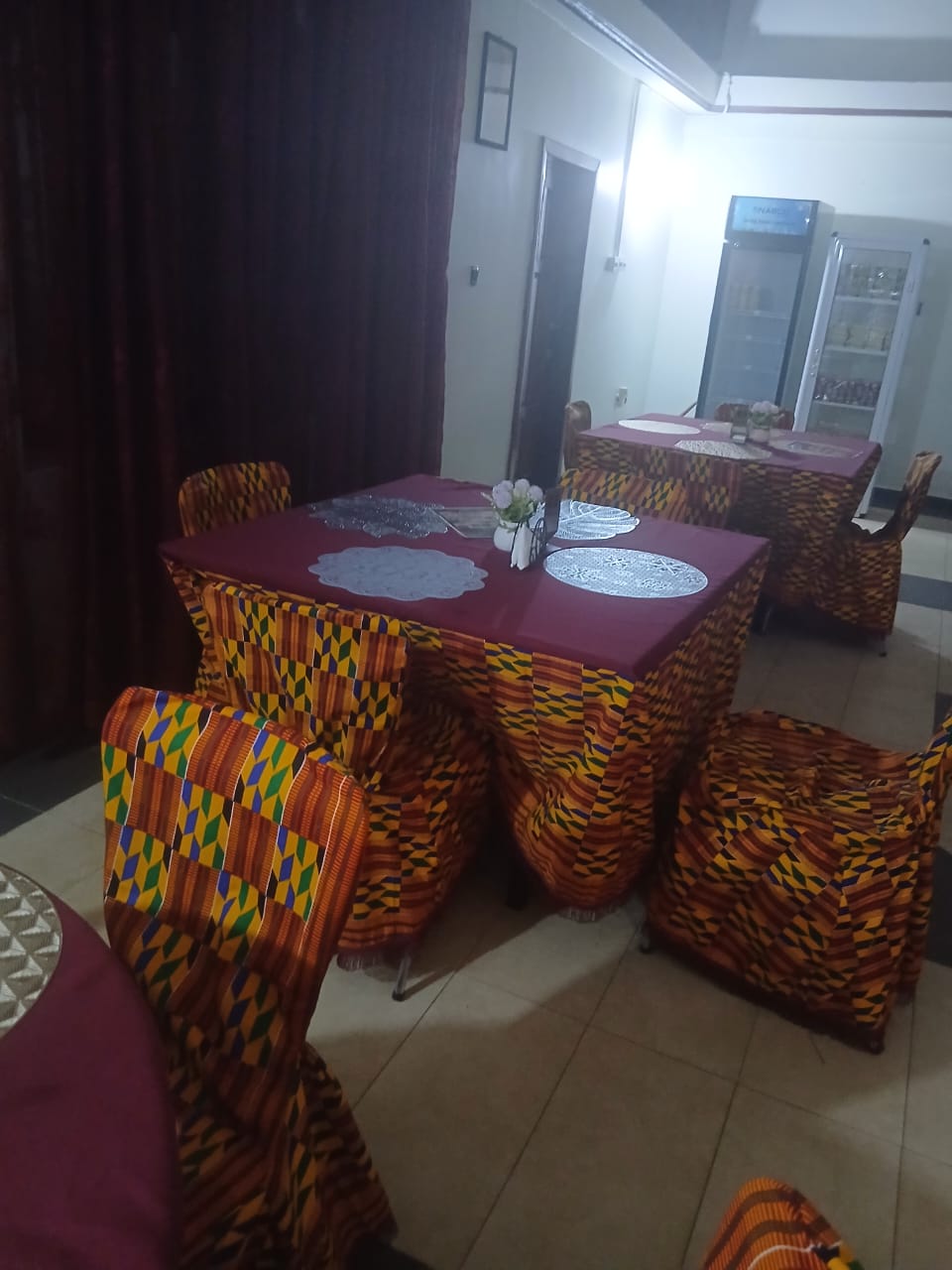 Dining tables in kente covers at Abank Village restaurant